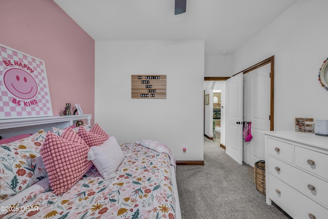 carpeted bedroom featuring a closet, a ceiling fan, and baseboards