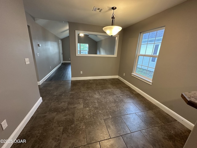 216 N Connor Ave, Joplin, MO 64801 - unfurnished dining area featuring baseboards and vaulted ceiling