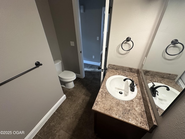 216 N Connor Ave, Joplin, MO 64801 - bathroom featuring toilet, vanity, and tile patterned floors