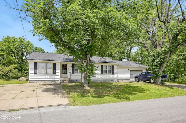 view of front of home with a garage, a front yard, and driveway