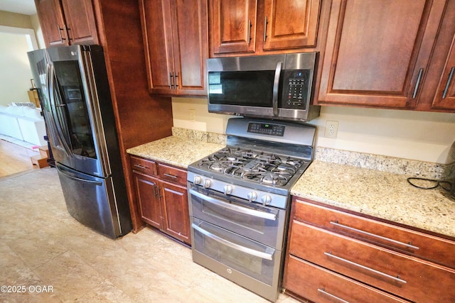 608 Sycamore Ln, Pittsburg, KS 66762 - kitchen with stainless steel appliances and light stone counters