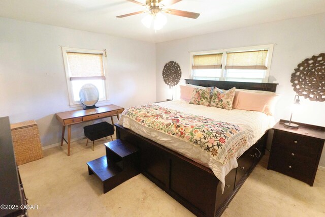 608 Sycamore Ln, Pittsburg, KS 66762 - bedroom featuring light colored carpet, baseboards, and a ceiling fan