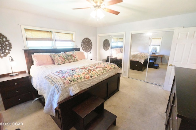 608 Sycamore Ln, Pittsburg, KS 66762 - bedroom with multiple windows, light carpet, multiple closets, and a ceiling fan