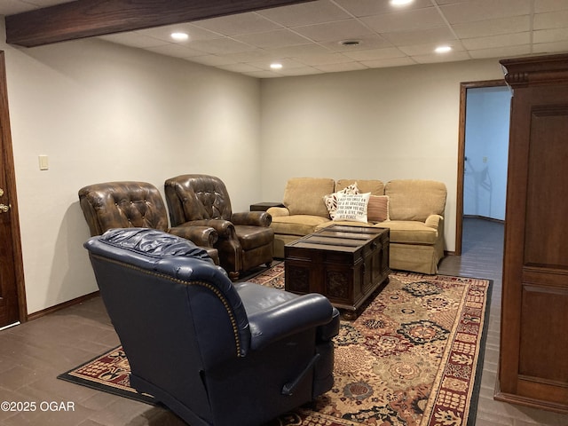 living room with recessed lighting and baseboards