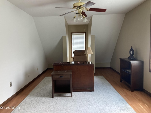 office space featuring ceiling fan, light wood-type flooring, and baseboards