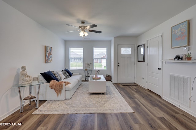 414 Eagle Edge Ave, Duenweg, MO 64841 - living area featuring dark wood finished floors, a ceiling fan, and baseboards