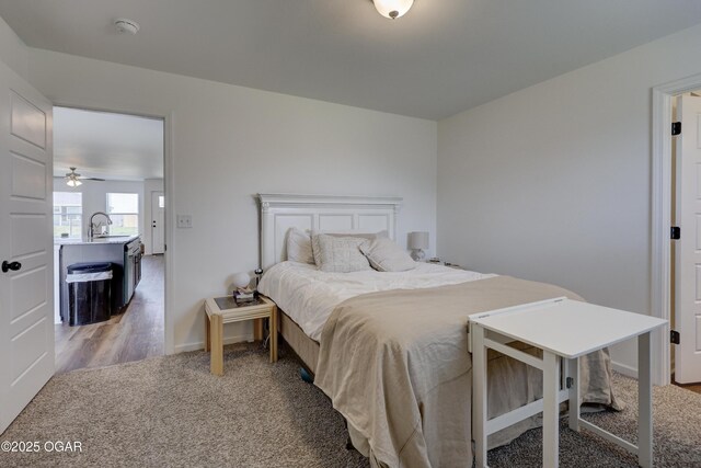 414 Eagle Edge Ave, Duenweg, MO 64841 - bedroom featuring a sink, light carpet, and baseboards