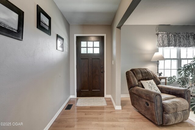 1912 N Duquesne Rd, Joplin, MO 64801 - foyer entrance featuring light wood-type flooring and baseboards