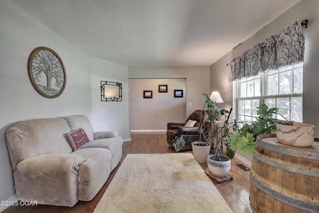 1912 N Duquesne Rd, Joplin, MO 64801 - living area featuring wood finished floors and baseboards