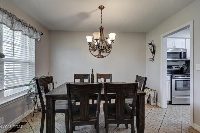 1912 N Duquesne Rd, Joplin, MO 64801 - dining room with a chandelier, light tile patterned floors, and baseboards