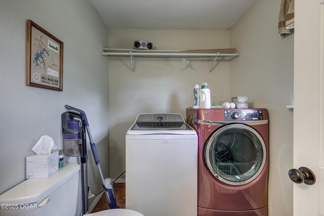 1912 N Duquesne Rd, Joplin, MO 64801 - clothes washing area featuring washer and clothes dryer and wood finished floors