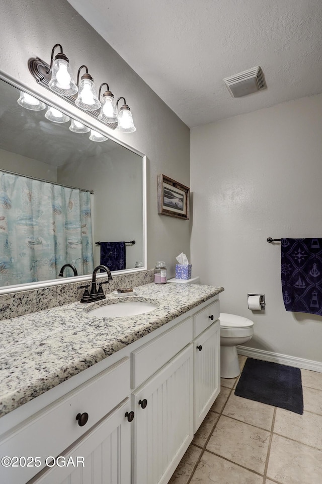 1912 N Duquesne Rd, Joplin, MO 64801 - full bathroom featuring tile patterned flooring, toilet, vanity, a textured ceiling, and baseboards
