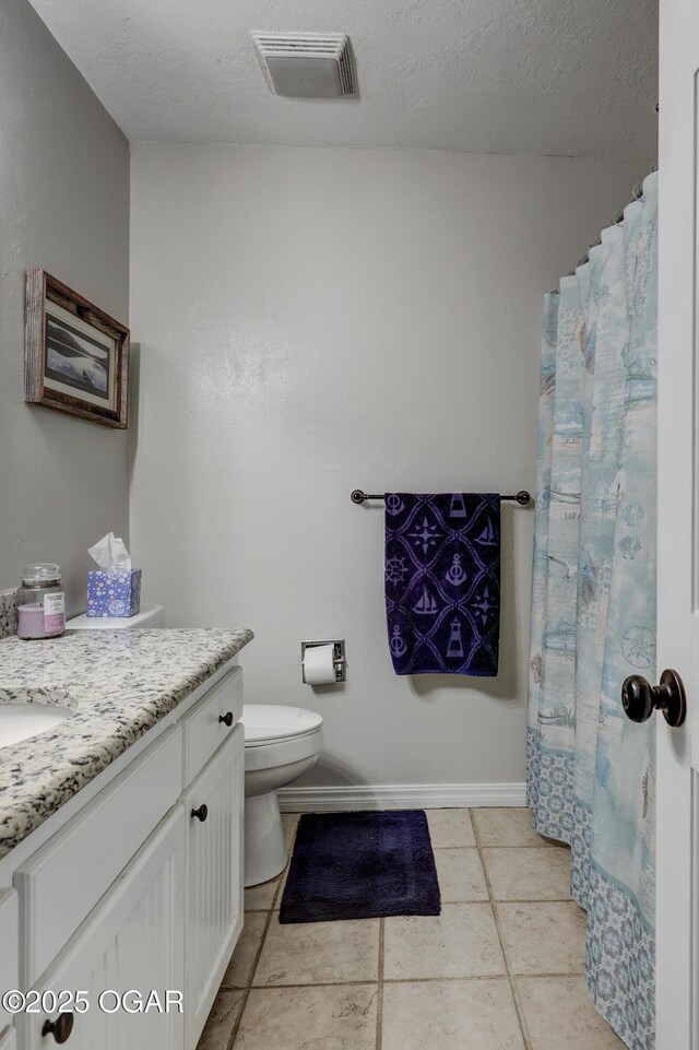 1912 N Duquesne Rd, Joplin, MO 64801 - bathroom featuring vanity, tile patterned flooring, and toilet