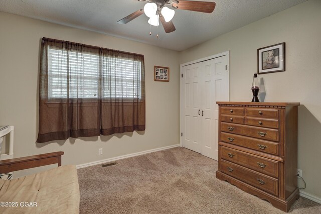 1912 N Duquesne Rd, Joplin, MO 64801 - carpeted bedroom with baseboards, a closet, and a ceiling fan