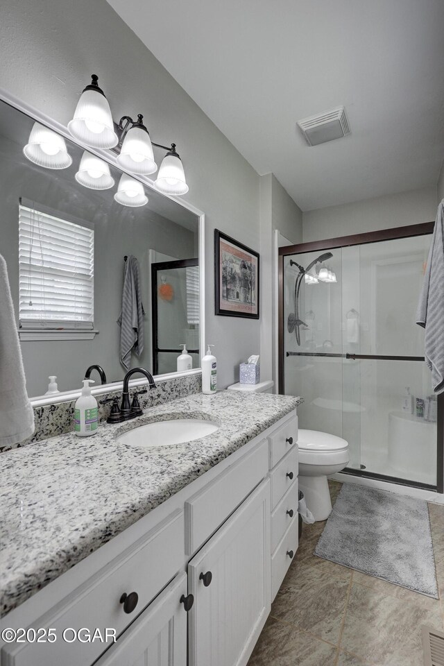 1912 N Duquesne Rd, Joplin, MO 64801 - bathroom with a stall shower, vanity, and toilet