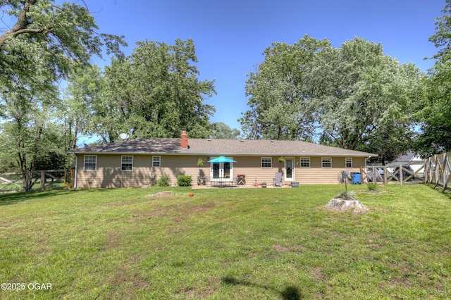 1912 N Duquesne Rd, Joplin, MO 64801 - rear view of property with a chimney and a patio