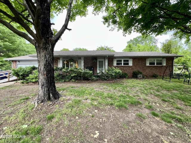 1321 Starlite Cir, Joplin, MO 64801 - ranch-style home with brick siding and an attached garage