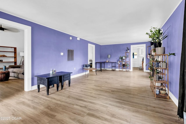 1815 S Empire Ave, Joplin, MO 64801 - living area with light wood-style flooring and baseboards