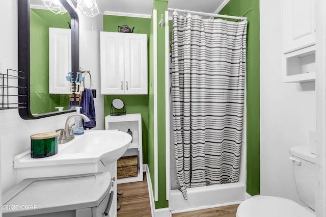 1815 S Empire Ave, Joplin, MO 64801 - bathroom with toilet, curtained shower, and wood finished floors