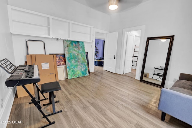 1815 S Empire Ave, Joplin, MO 64801 - workout area featuring light wood finished floors, a ceiling fan, and baseboards