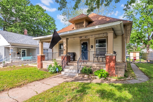 1815 S Empire Ave, Joplin, MO 64801 - bungalow with covered porch and roof with shingles