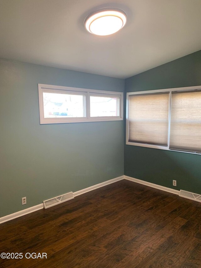 2803 S Missouri, Joplin, MO 64804 - unfurnished room featuring dark wood-type flooring and baseboards