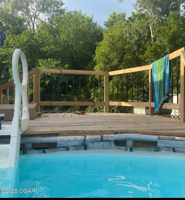 811 N Elloitt St, Webb City, MO 64870 - swimming pool with a wooden deck