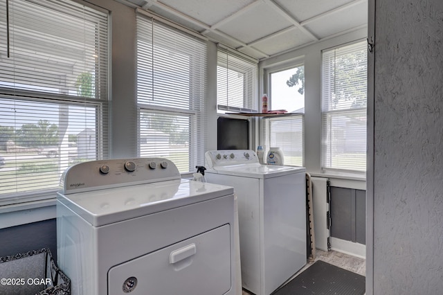 1712 E Broadway St, Joplin, MO 64801 - laundry area featuring separate washer and dryer, healthy amount of natural light, and wood finished floors