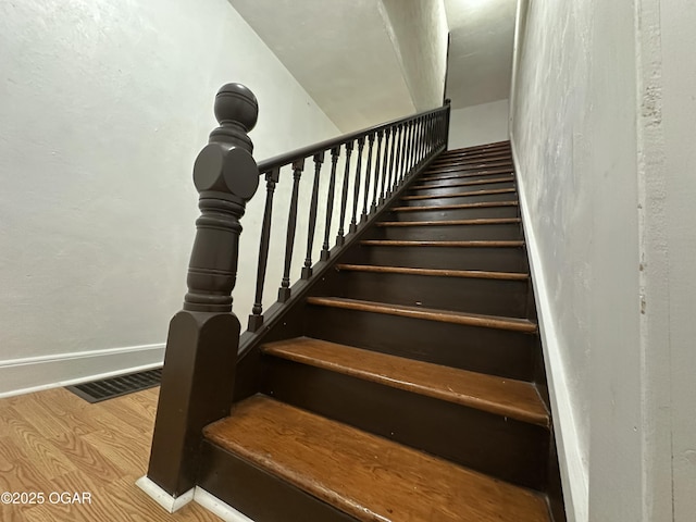 1712 E Broadway St, Joplin, MO 64801 - staircase featuring wood finished floors and baseboards