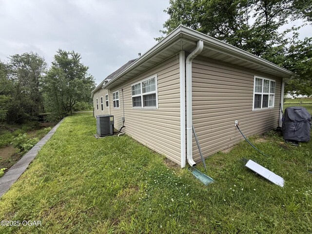 304 Market St, Wentworth, MO 64873 - view of side of property featuring central air condition unit and a yard