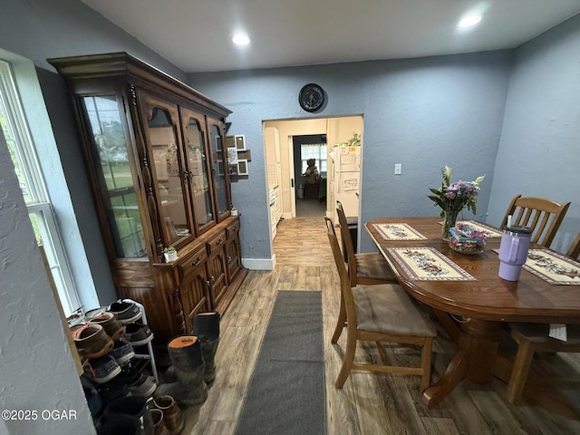 304 Market St, Wentworth, MO 64873 - dining space with light wood-style floors, a textured wall, recessed lighting, and baseboards