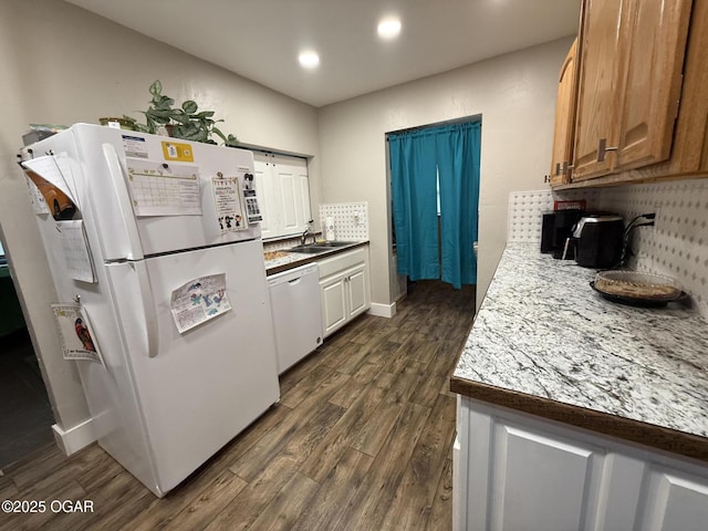 304 Market St, Wentworth, MO 64873 - kitchen with white appliances, dark wood-type flooring, recessed lighting, a sink, and decorative backsplash