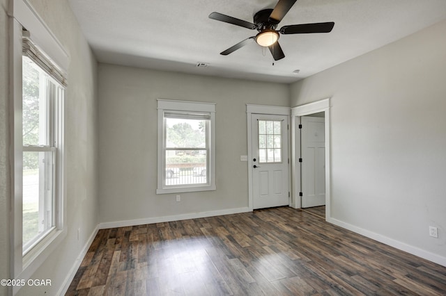 328 N Connor Ave, Joplin, MO 64801 - entrance foyer featuring plenty of natural light, dark wood-style floors, and baseboards