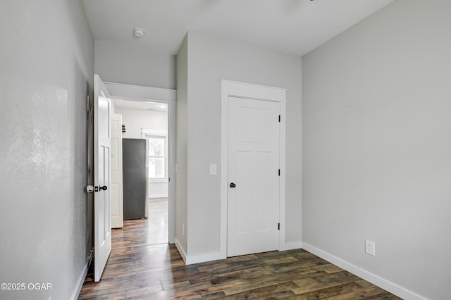 328 N Connor Ave, Joplin, MO 64801 - hall featuring dark wood-style floors and baseboards