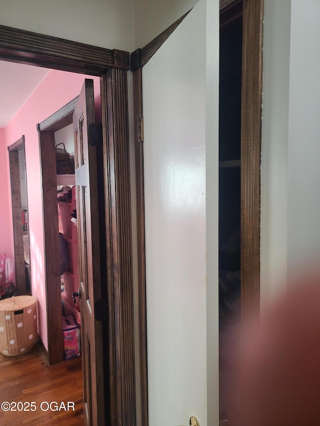 511 3rd St, Mccune, KS 66753 - hallway featuring wood finished floors