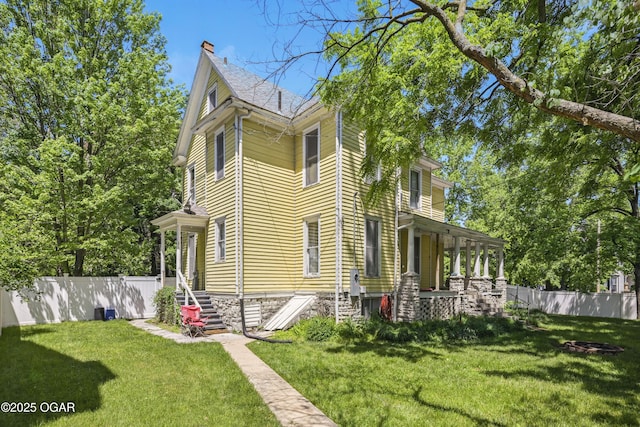 524 W 5th St, Joplin, MO 64801 - view of side of home with a chimney
