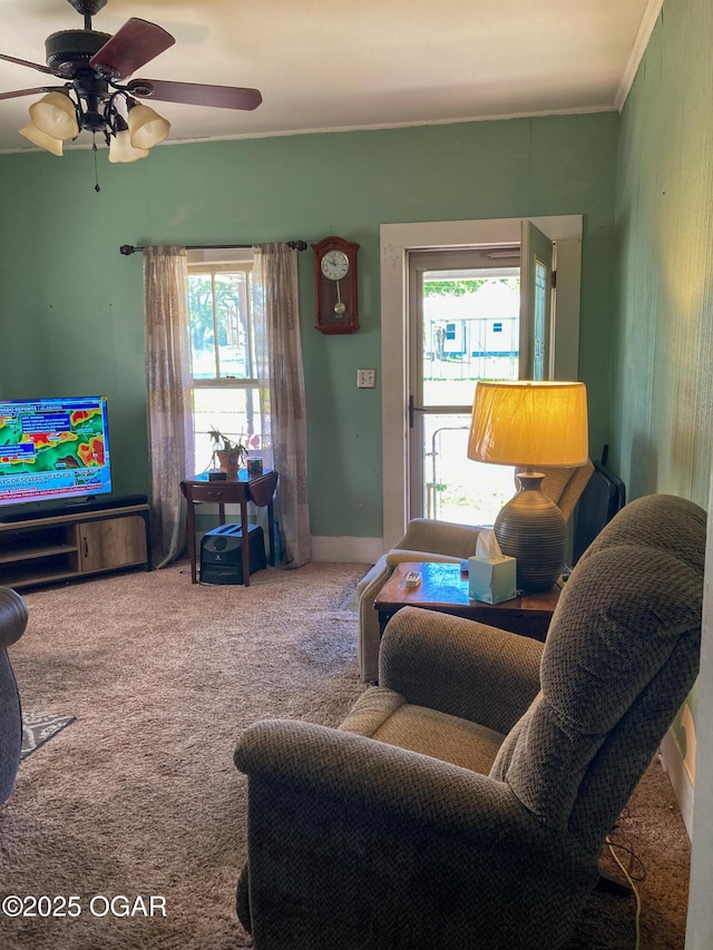 1017 E Broadway St, Joplin, MO 64801 - living area featuring healthy amount of natural light, carpet, and a ceiling fan