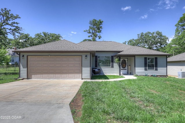 2615 E Xenia St, Joplin, MO 64801 - ranch-style home with concrete driveway, a garage, a shingled roof, and cooling unit