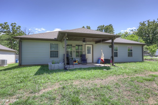 2615 E Xenia St, Joplin, MO 64801 - rear view of property featuring a ceiling fan, a patio, cooling unit, a yard, and a shingled roof