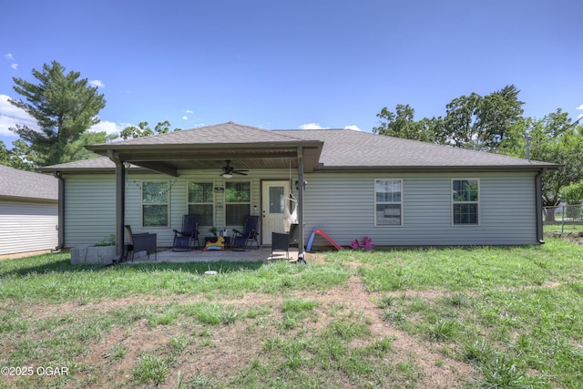 2615 E Xenia St, Joplin, MO 64801 - rear view of house with a ceiling fan, a patio area, and a yard