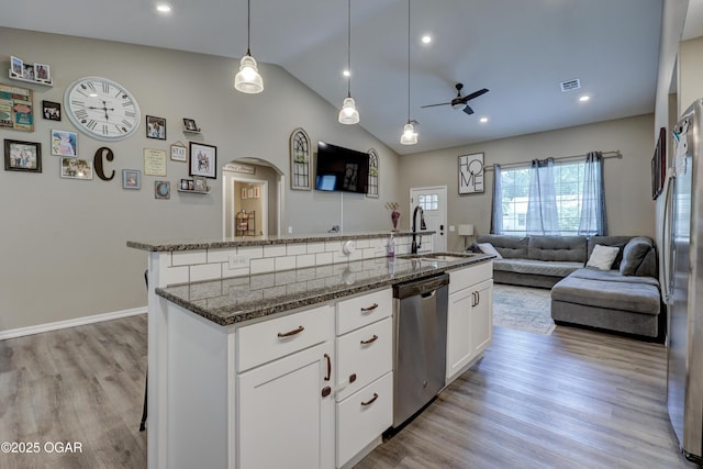 2615 E Xenia St, Joplin, MO 64801 - kitchen with a sink, appliances with stainless steel finishes, open floor plan, ceiling fan, and an island with sink