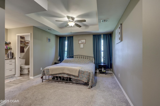 2615 E Xenia St, Joplin, MO 64801 - bedroom featuring a raised ceiling, light colored carpet, baseboards, and a ceiling fan