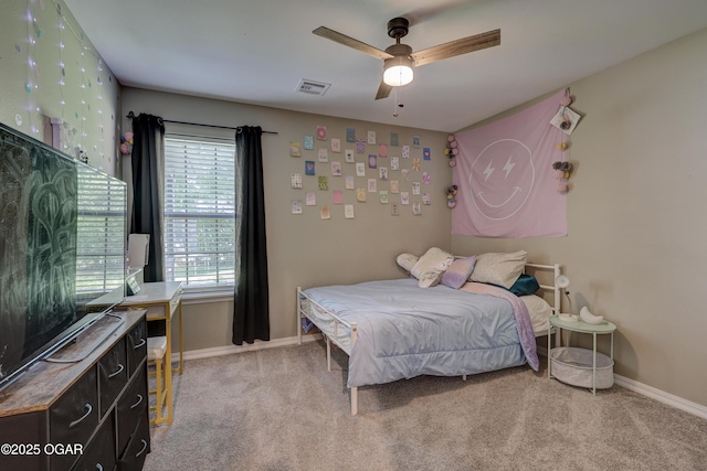 2615 E Xenia St, Joplin, MO 64801 - bedroom with light carpet, baseboards, and ceiling fan
