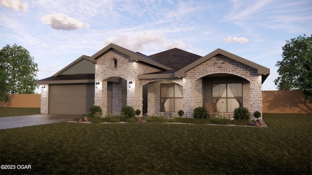 1507 E White Oak St, Joplin, MO 64801 - french country style house with a garage, concrete driveway, and brick siding