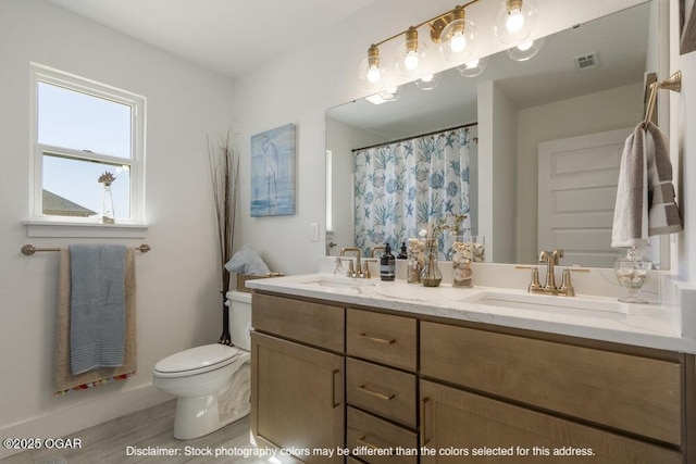 1713 E White Oak St, Joplin, MO 64801 - full bathroom with toilet and double vanity