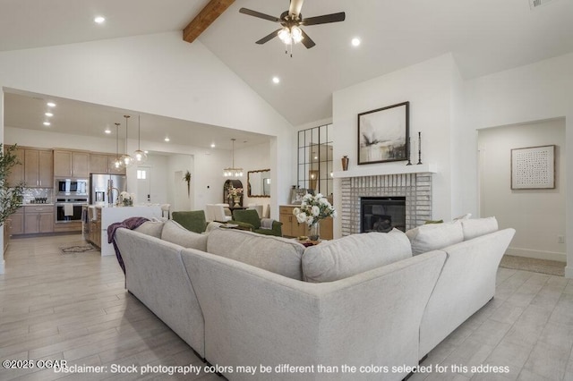 1713 E White Oak St, Joplin, MO 64801 - living area with high vaulted ceiling, beam ceiling, ceiling fan, a brick fireplace, and recessed lighting