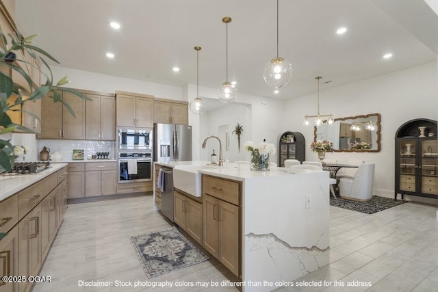 1713 E White Oak St, Joplin, MO 64801 - kitchen featuring stainless steel appliances, a sink, light countertops, tasteful backsplash, and recessed lighting