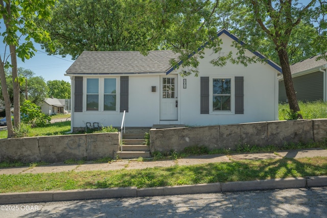 201 S Tom, Webb City, MO 64870 - view of front of home featuring stucco siding and roof with shingles