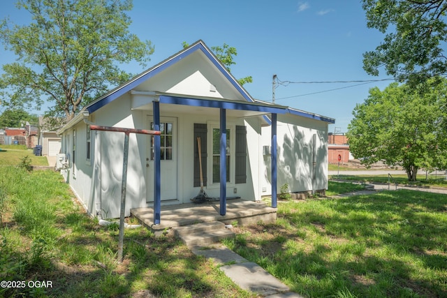 201 S Tom, Webb City, MO 64870 - rear view of property with covered porch and a yard