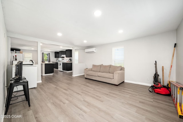201 S Tom, Webb City, MO 64870 - living area with a wall unit AC, recessed lighting, light wood-style flooring, and baseboards